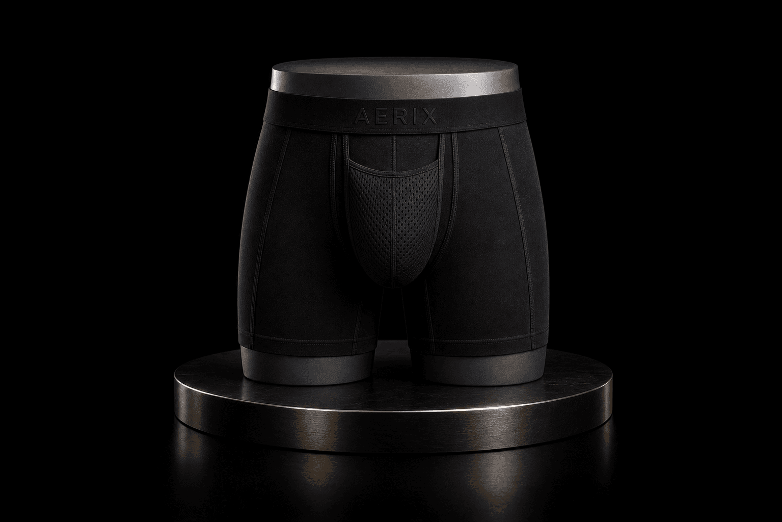 Black breathable AERIX AirBridge men’s boxer briefs on a premium plinth
